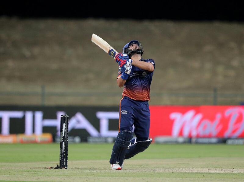 Abu Dhabi, United Arab Emirates - November 17, 2019: Qalandars' Jordan Clark takes the wicket of Arabians' Yuraj Singh caught and bowled during the game between Maratha Arabians and Qalandars in the Abu Dhabi T10 league. Sunday the 17th of November 2019. Zayed Cricket Stadium, Abu Dhabi. Chris Whiteoak / The National