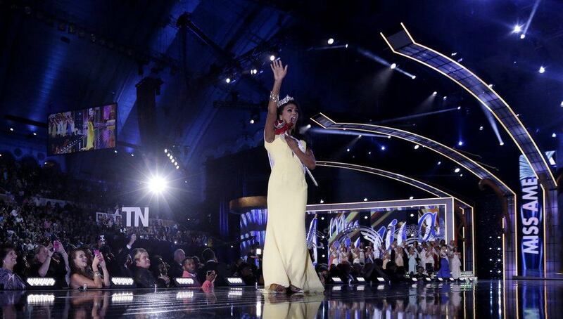 Miss New York Nina Davuluri walks on the runway after being crowned as Miss America 2014 in Atlantic City, N.J. AP Photo/Julio Cortez 