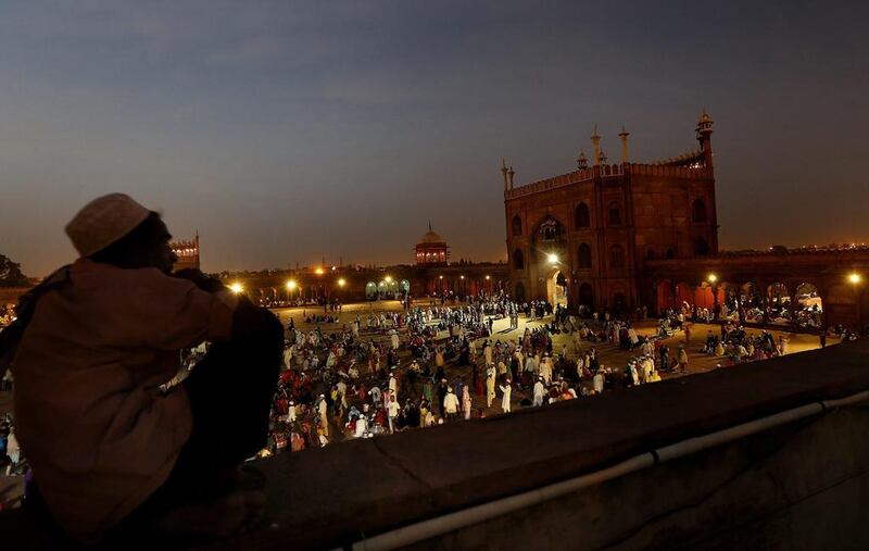 As night falls, the picnickers at the Jama Masjid fold up their tablecloths and the main thoroughfares of Old Delhi begin to fall silent.  Harish Tyagi/EPA