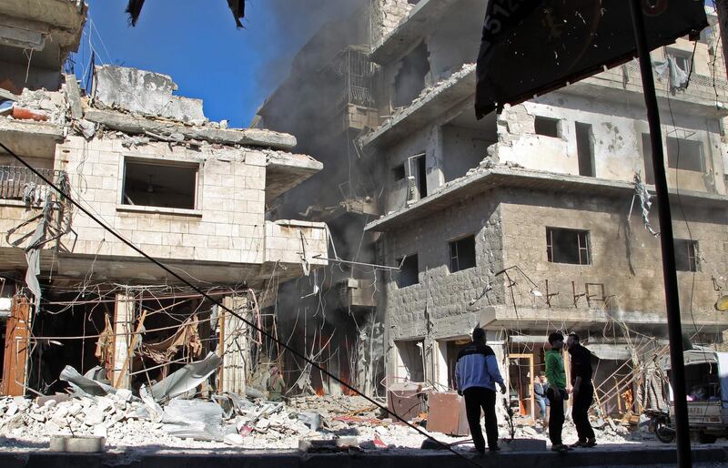 Smoke billows from a building following a reported bombardment by pro-Syrian government forces in the town of Maaret al-Numan in Syria's Idlib province, the country's last major opposition bastion. AFP