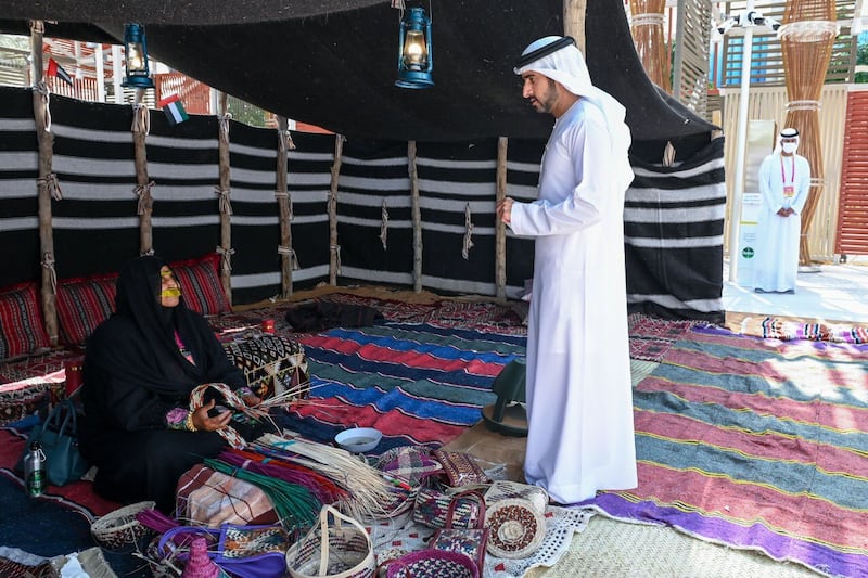 Sheikh Hamdan bin Mohammed, Crown Prince of Dubai, talks to an artisan at the Sameem pavilion on Monday. Photo: Twitter