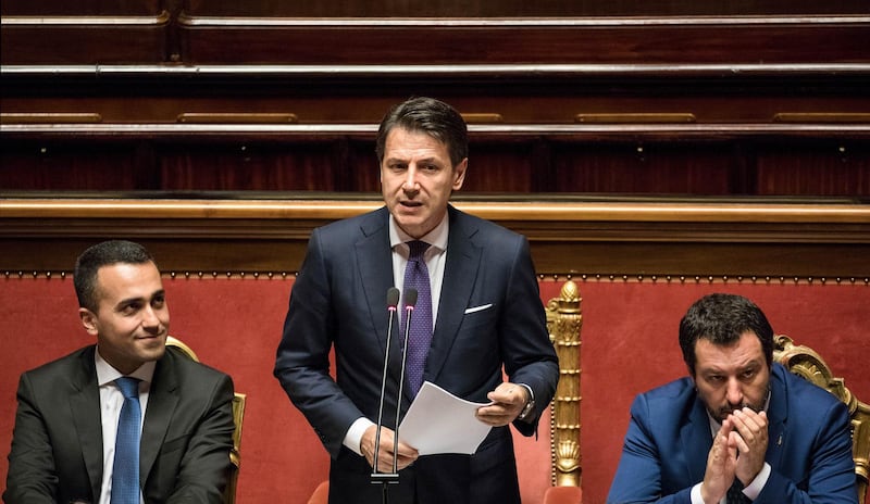 Giuseppe Conte, Italy's prime minister, center, delivers his maiden speech to the Senate as Luigi Di Maio, Italy's deputy prime minster, left, and Matteo Salvini, Italy's deputy prime minister, right, look on in Rome, Italy, on Tuesday, June 5, 2018. Civil law professor Conte, 53, was vaulted from faculty battles at Florence University to the head of a potentially fractious coalition when Luigi Di Maio of the Five Star Movement and League Leader Matteo Salvini needed an outsider to reconcile their different priorities. Photographer: Alessia Pierdomenico/Bloomberg
