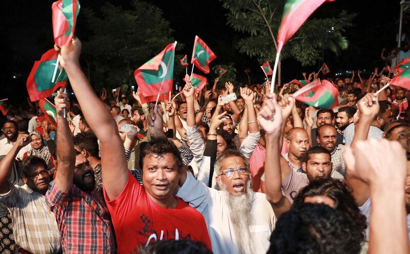 Maldivian opposition protestors shout slogans demanding the release of political prisoners during a protest in Male, Maldives, Friday, Feb. 2, 2018. Supporters of political parties that oppose the Maldives government have clashed with police on the streets of the capital after the country's supreme court ordered the release of imprisoned politicians. (AP Photo/Mohamed Sharuhaan)