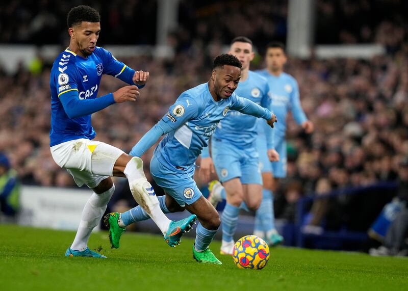 Raheem Sterling of Manchester City battles for the ball with Mason Holgate of Everton. EPA