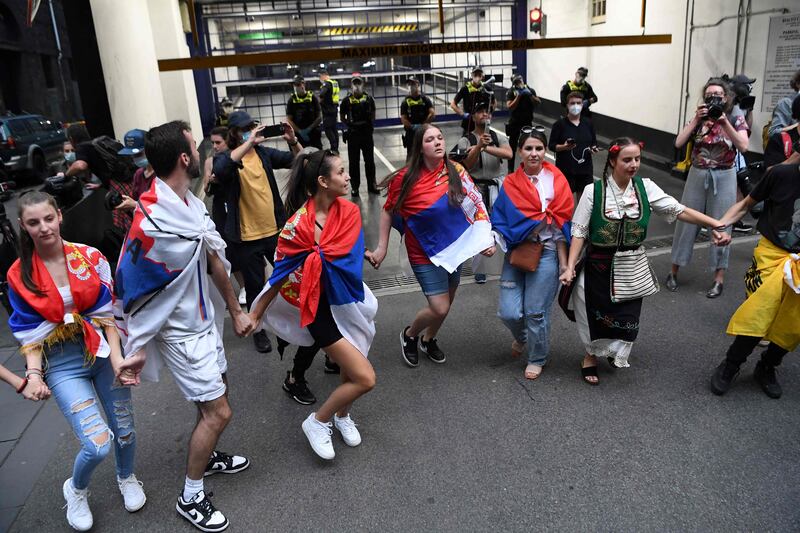 Members of the local Serbian community play music and dance outside the legal offices where Serbia's tennis champion Novak Djokovic is in with his legal team in Melbourne. AFP