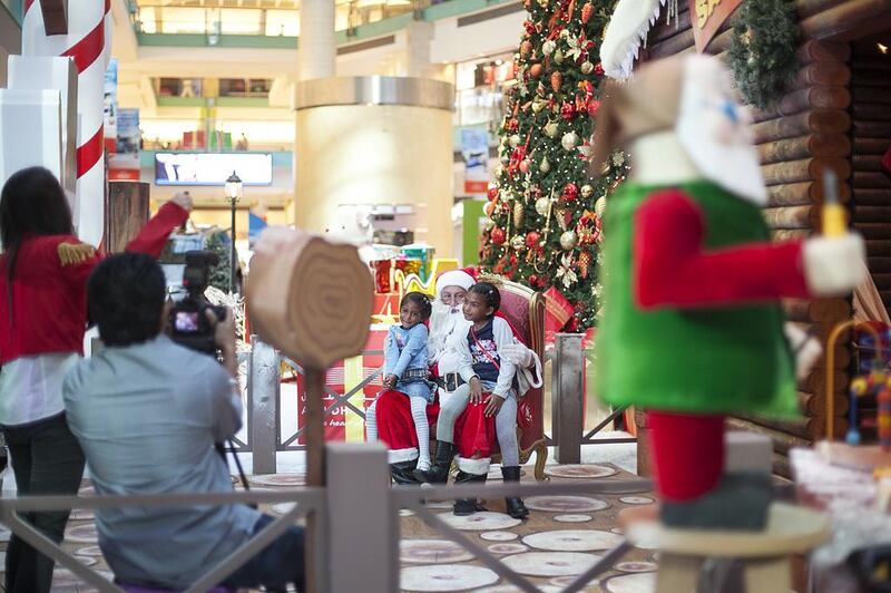 Santa spreads good cheer at the Abu Dhabi Mall. Mona Al Marzooqi/ The National
