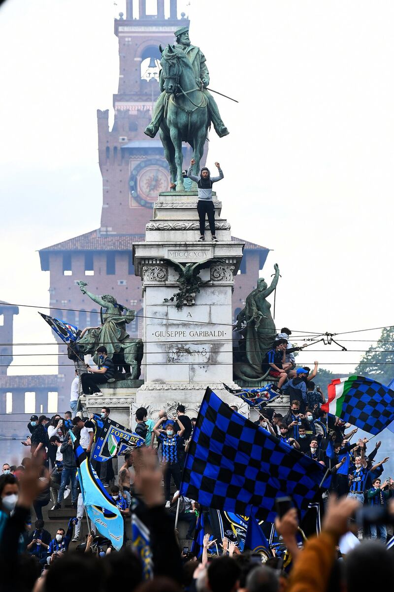Inter Milan fans celebrate winning Serie A at the Piazza Castello. Reuters