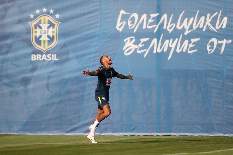 Neymar enjoys himself during the training session. Hannah McKay / Reuters