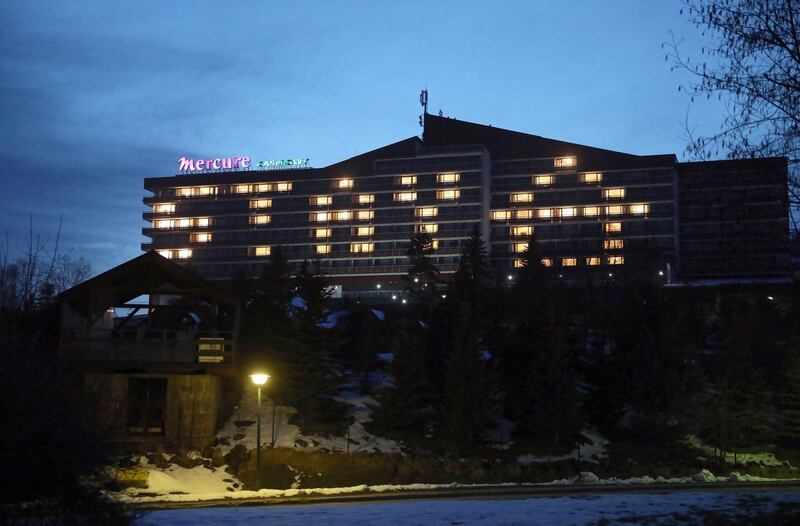 Lights left on in rooms of an empty hotel read 'stay home' in the mountain resort of Zakopane, Poland. EPA