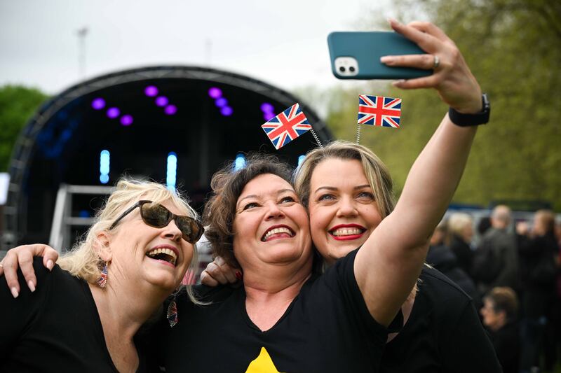 Women take selfies at The Big Lunch in Windsor. Getty Images