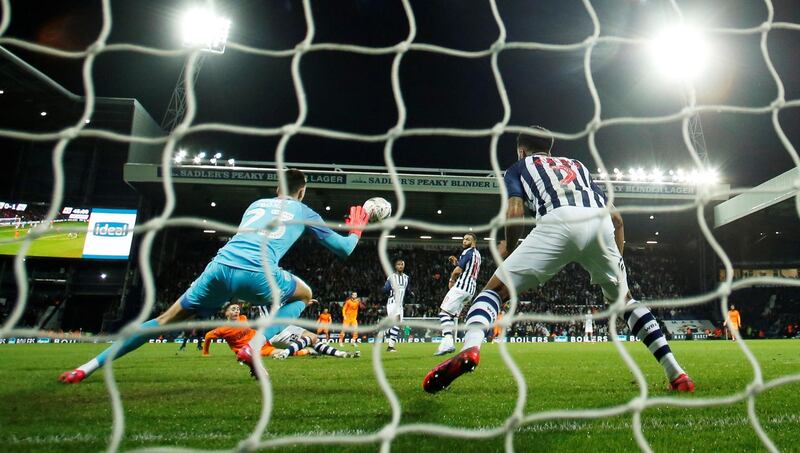 Newcastle United's Miguel Almiron scores their second goal. Reuters