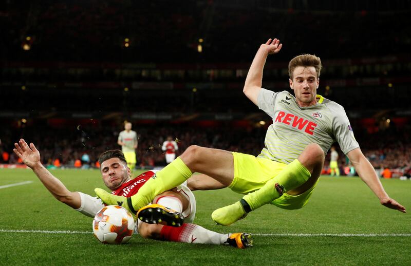 Cologne's Lukas Klunter in action with Arsenal's Sead Kolasinac. John Sibley / Reuters