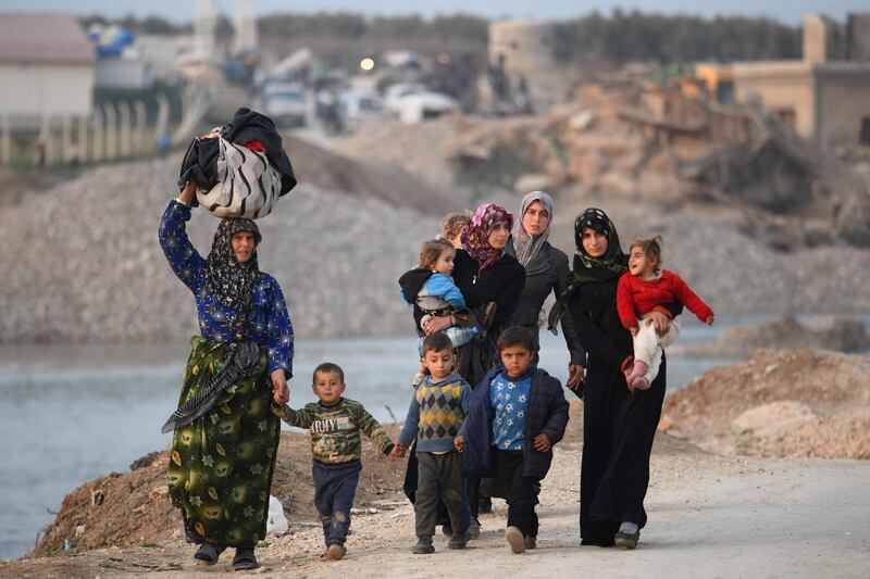 Displaced Syrians arrive to Deir al-Ballut camp in Afrin's countryside, along the border with Turkey.  AFP