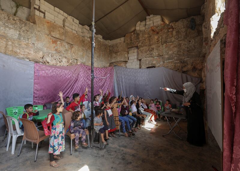 Pupils attend a class inside a Byzantine castle that has been transformed into a makeshift school for internally displaced children, in the opposition-held Idlib region of Syria. All photos: Reuters 