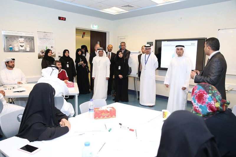 Officials from the National Qualifications Authority and the Abu Dhabi Education Council issued mock examinations to teachers as part of the TELS UAE Pilot Project last November. The pilot paves the way for introducing the country's first national teacher licensing system. Courtesy ADEC