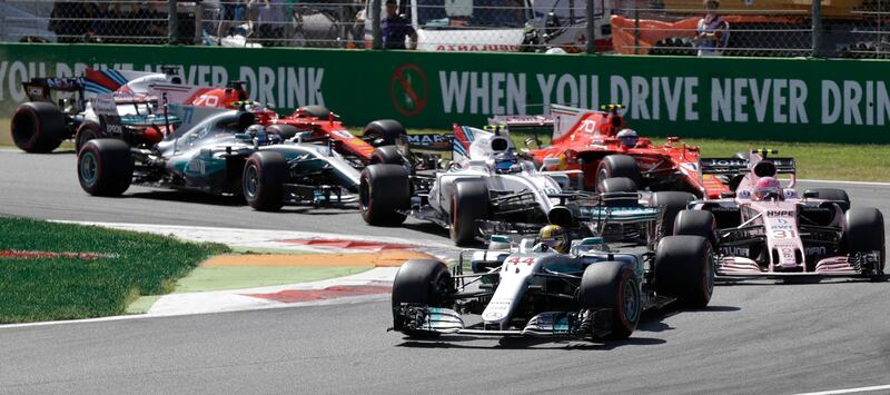 Mercedes driver Lewis Hamilton of Britain leads Force India driver Esteban Ocon of France and the rest of the pack, during the first laps of the Italian Formula One Grand Prix, at the Monza racetrack, Italy, Sunday, Sept. 3, 2017. (AP Photo/Luca Bruno)