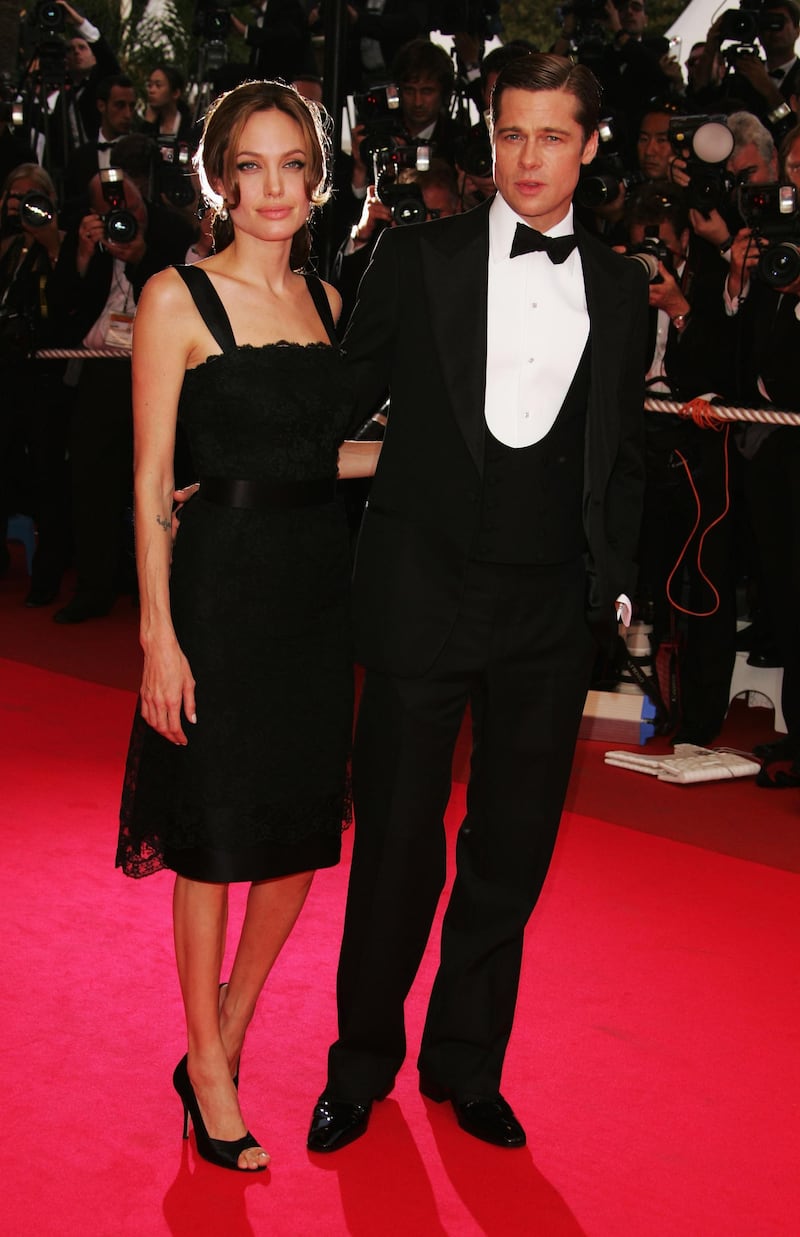 CANNES, FRANCE - MAY 21:  (R-L) Actors Brad Pitt and Angelina Jolie attend the premiere for the film "A Mighty Heart" at the Palais des Festivals during the 60th International Cannes Film Festival on May 21, 2007 in Cannes, France.  (Photo by Peter Kramer/Getty Images)