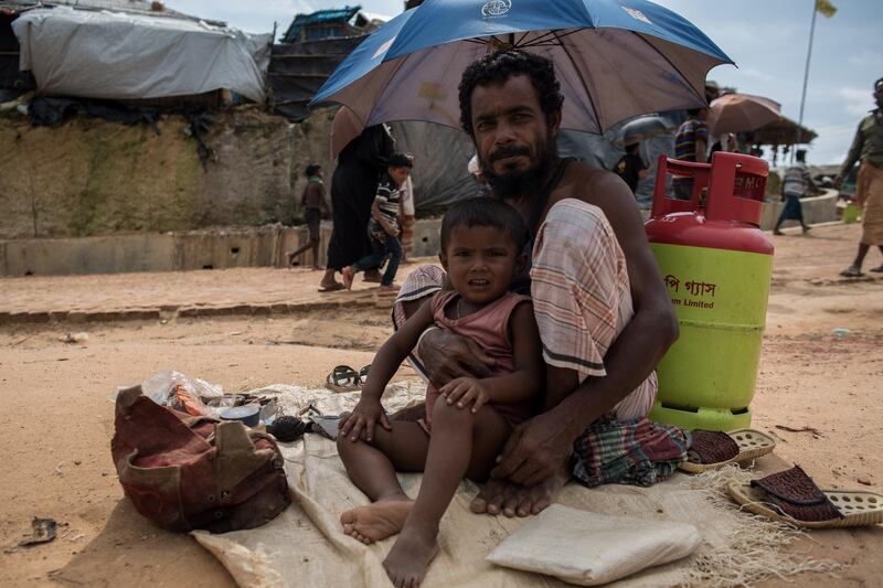 A Rohingya refugee and his child in a camp near Cox's Bazar, Bangladesh, August 11 2018. Campbell MacDiarmid for The National