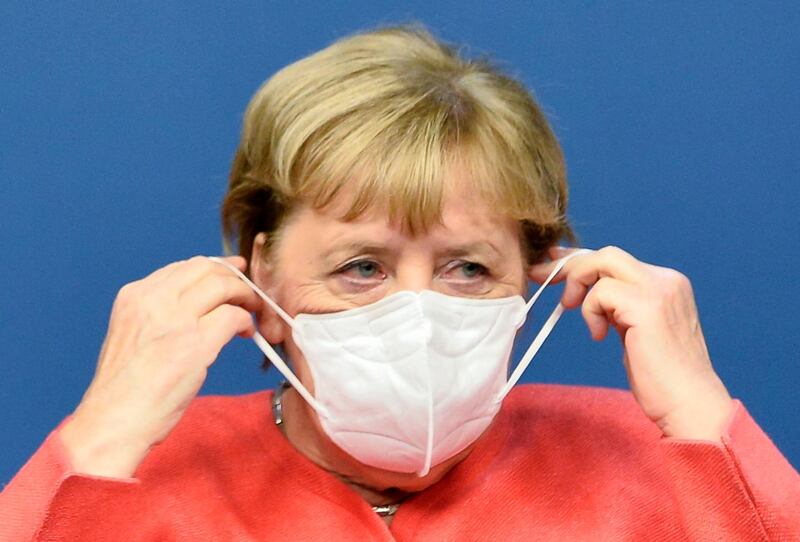 epa08715105 Germany's Chancellor Angela Merkel puts on her protective mask after speaking in a news conference during the second face-to-face EU summit since the coronavirus disease (COVID-19) outbreak, in Brussels, Belgium, 02 October 2020. During this Special European Council, EU leaders will discuss foreign affairs, in particular relations with Turkey and the situation in the Eastern Mediterranean. The leaders are also expected to address relations with China, the situation in Belarus and the poisoning of Alexei Navalny.  EPA/JOHANNA GERON / POOL