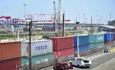 (FILES) In this file photo taken on July 12, 2018 shipping containers, including those from COSCO, a Chinese state-owned shipping and logistics company await transportation on a rail line at the Port of Long Beach in Long Beach, California.  US President Donald Trump has decided to impose tariffs on $200 billion in Chinese imports and could make the announcement in the coming days, US media reported September 15, 2018. Citing anonymous sources, The Washington Post and The Wall Street Journal reported that the tariffs would be set at 10 percent. / AFP / Frederic J. BROWN
