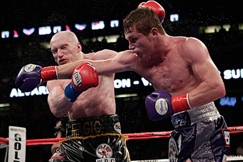 Saul Alvarez, right, connects with a right-hook during his points victory against Matthew Hatton for vacant WBC light-middleweight belt.