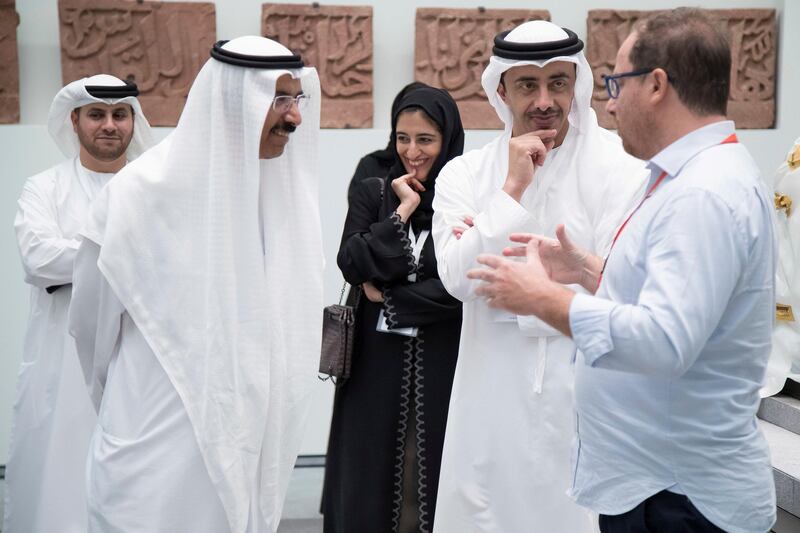 SAADIYAT ISLAND, ABU DHABI, UNITED ARAB EMIRATES -September 11, 2017: HH Sheikh Abdullah bin Zayed Al Nahyan, UAE Minister of Foreign Affairs and International Cooperation (R) and HE Mohamed Al Murr, former Speaker of the UAE Federal National Council (FNC) (L), tour the Louvre Abu Dhabi. Seen with HE Dr Ahmed Mubarak Al Mazrouei, Chairman of the Abu Dhabi Water and Electricity Authority (ADWEA), and Secretary-General of the Executive Council (back L) and HE Najla Al Awar, UAE Minister of Community Development (back R). 

( Omar Al Askar  for The Crown Prince Court - Abu Dhabi )
---