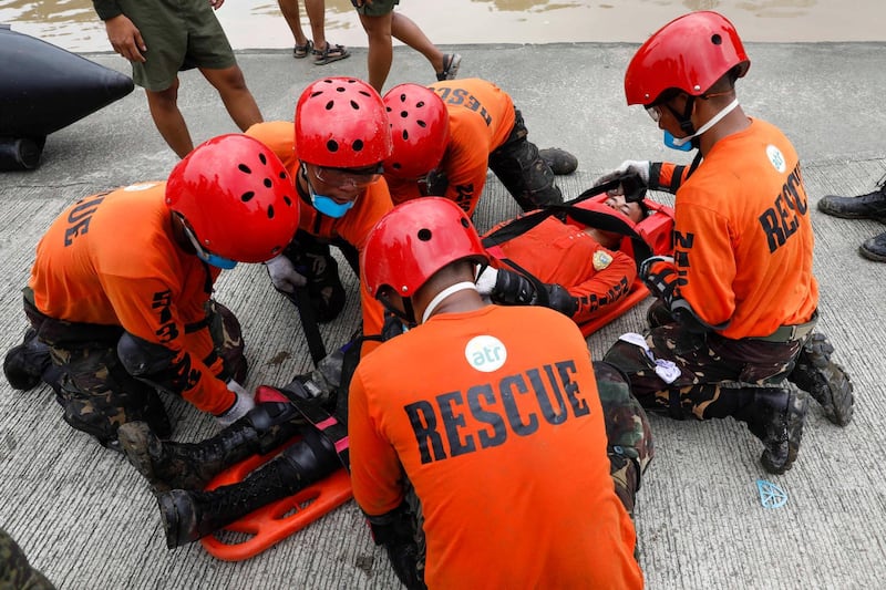 Philippine Army soldiers hold drills along the banks of the Marikina River, east of Manila. EPA