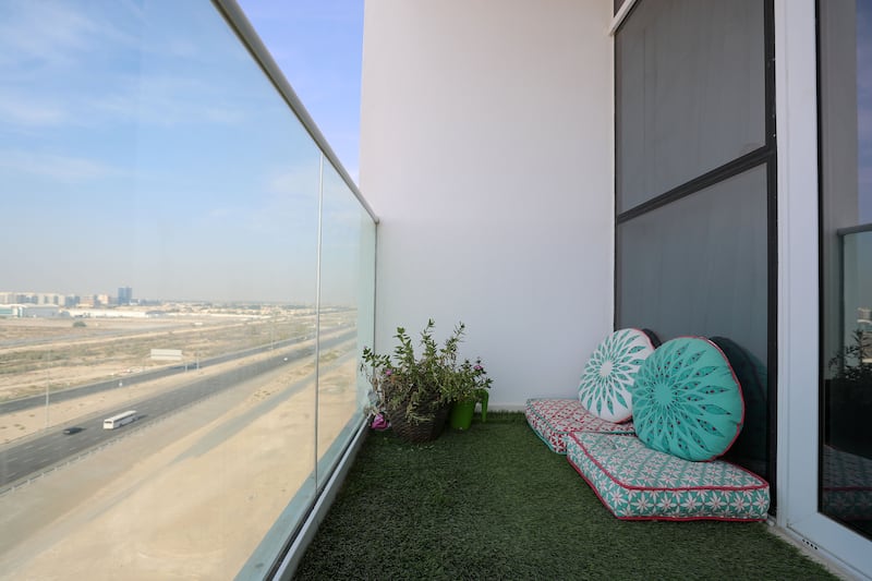 Ms Talaat installed artificial turf on her balcony as greenery is important to her.