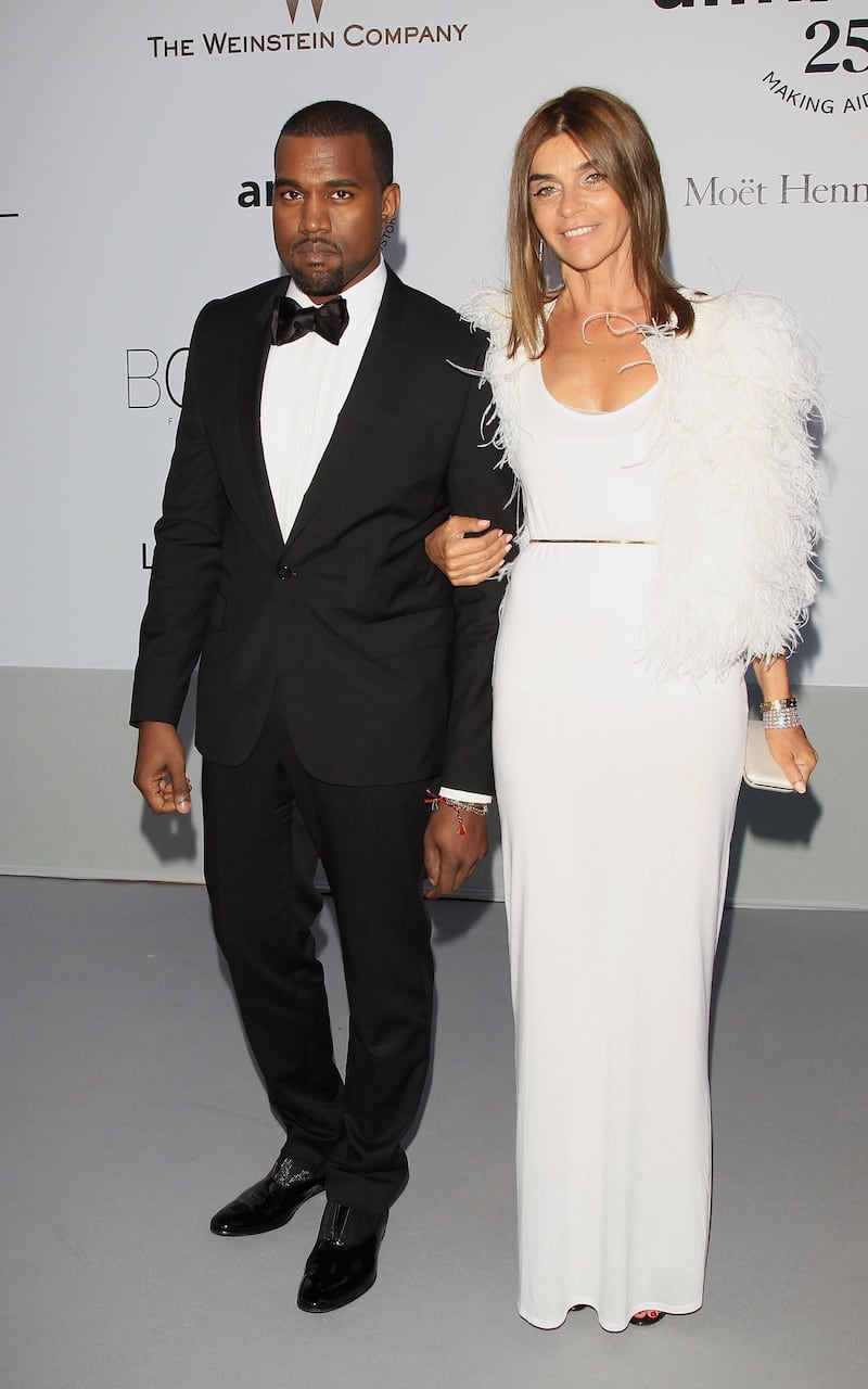 ANTIBES, FRANCE - MAY 19:  Kanye West and Carine Roitfeld attend amfAR's Cinema Against AIDS Gala during the 64th Annual Cannes Film Festival at Hotel Du Cap on May 19, 2011 in Antibes, France.  (Photo by Andreas Rentz/Getty Images)