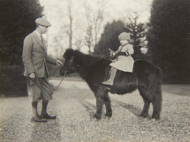 Britain’s Queen Elizabeth II with the Duke of York on Shetland pony, Peggy in 1930. The Royal Collection / AP photo