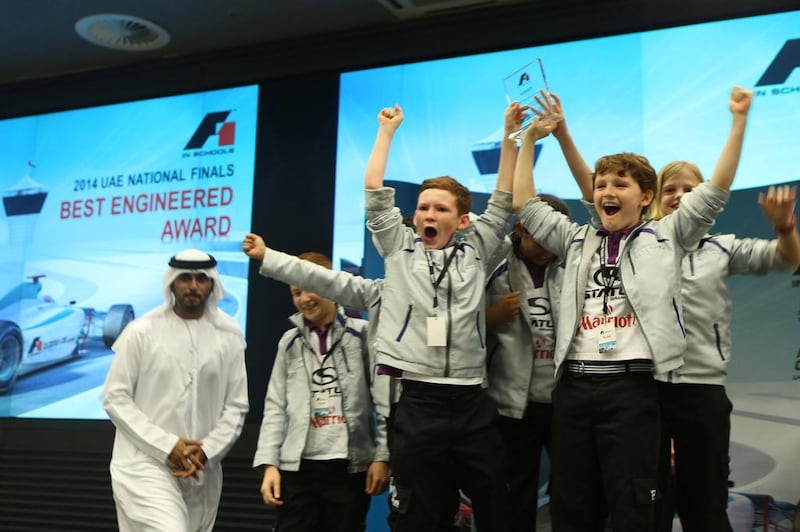 Austin Adamson, front centre, and Findlay Broch McCallum, right, centre, along with the rest of their Project Speed team from Repton School in Dubai celebrate.