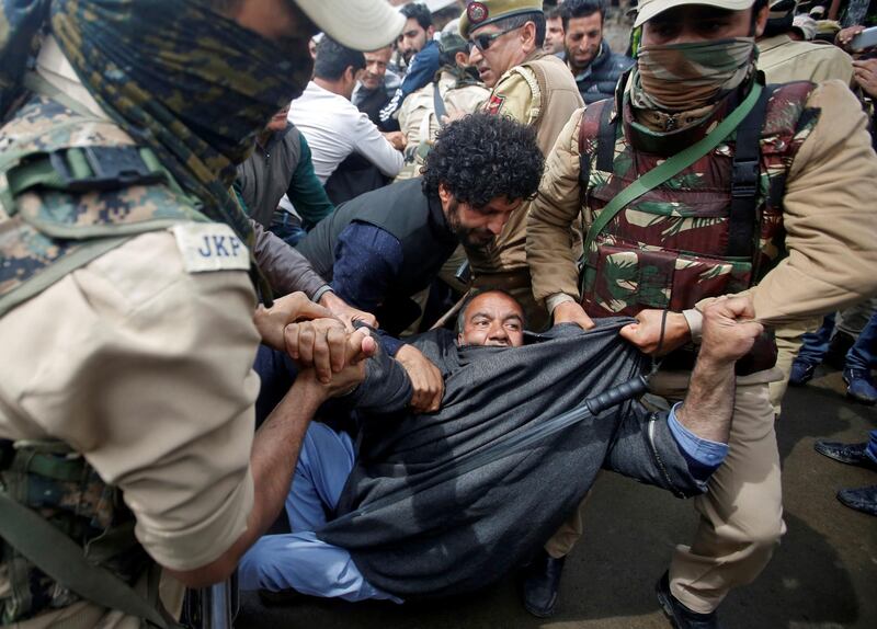 A supporter of Awami Ittihad Party, a pro-India party, is detained by Indian police during a protest against the recent killings in Kashmir. Danish Ismail / Reuters