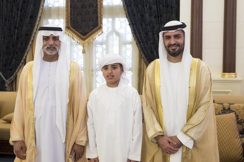 From left: Sheikh Nahyan bin Mubarak, Minister of Culture and Knowledge Development, Sheikh Zayed bin Mohamed bin Hamad bin Tahnoon Al Nahyan, and Sheikh Mohamed bin Hamad bin Tahnoon Al Nahyan, attend an Eid Al Fitr reception. Ryan Carter / Crown Prince Court - Abu Dhabi