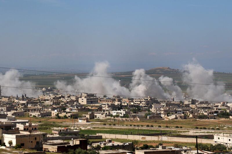 Smoke billows following shelling in Khan Sheykun in Syria's jihadist-held Idlib province on May 10, 2019. Violence in the northwestern Syrian region of Idlib has displaced more than 150,000 people in the past week, the UN said, as the regime and Russia upped deadly bombardment of the jihadist bastion. The uptick in strikes and shelling on the region dominated by Syria's former Al-Qaeda affiliate has also knocked 12 hospitals and 10 schools out of action, it said.
 / AFP / Anas AL-dyab
