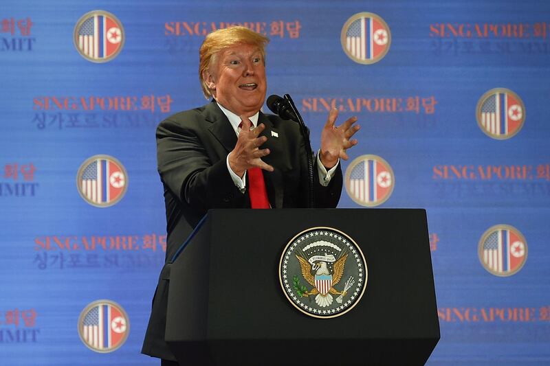 TOPSHOT - US President Donald Trump speaks at a press conference following the historic US-North Korea summit in Singapore on June 12, 2018. Donald Trump and Kim Jong Un hailed their historic summit on June 12 as a breakthrough in relations between Cold War foes, but the agreement they produced was short on details about the key issue of Pyongyang's nuclear weapons. / AFP / Anthony WALLACE

