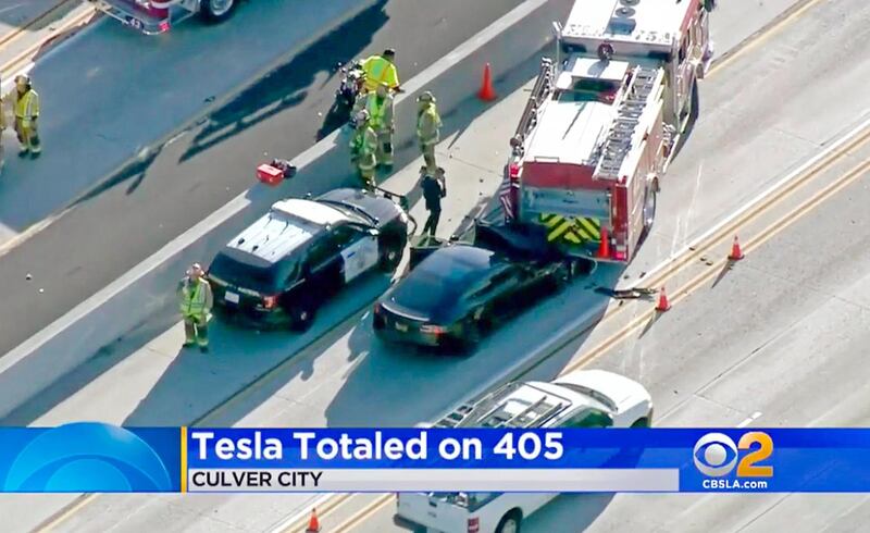 FILE - This Jan. 22, 2018, file still frame from video provided by KCBS-TV shows a Tesla Model S electric car that has crashed into a fire engine on Interstate 405 in Culver City, Calif. A government report says the driver of the Tesla that slammed into a firetruck was using the carâ€™s Autopilot system when a vehicle in front of him suddenly changed lanes and he didnâ€™t have time to react. The National Transportation Safety Board said Tuesday, Sept. 3, 2019, that the driver never saw the parked firetruck and didnâ€™t brake. (KCBS-TV via AP, File)