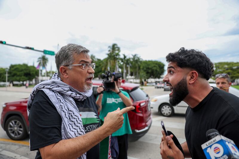 A pro-Palestinian activist, left, argues with an Israel supporter during a rally in Miami, Florida in support of Palestinians in Gaza. AP