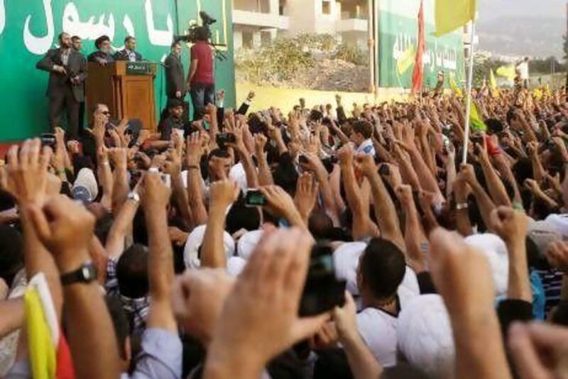 Hizbollah supporters raise their hands in support of their leader, Hassan Nasrallah, during a rally in Beirut denouncing an anti-Islam film that has provoked a week of unrest in Muslim countries globally.