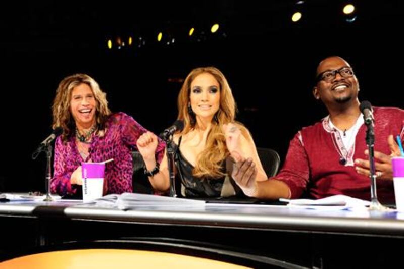 American Idol judges Steven Tyler, Jennifer Lopez and Randy Jackson say contestants should be prepared for tough love this year. Michael Becker / Fox / AP Photo