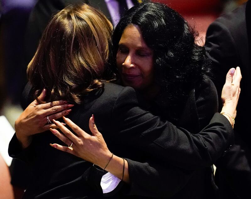 RowVaughn Wells, right, hugs Ms Harris during the funeral service for her son, Mr Nichols. AP