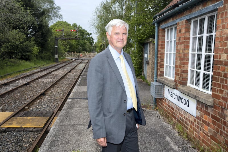 Paul Peachey feature on reinstating old railway lines, including the line the line in the New Forrest near Holmsley. Local councillor David Harrison photographed at  Marchwood station which he hopes will benifit from governement plans to open old train lines. Currently the line is used only a few times a week by the local power plant and military base.