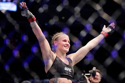 Valentina Shevchecko celebrates her win against Katlyn Chookagian in a women's flyweight mixed martial arts bout at UFC 247 on Saturday, Feb. 8, 2020, in Houston. (AP Photo/Michael Wyke)