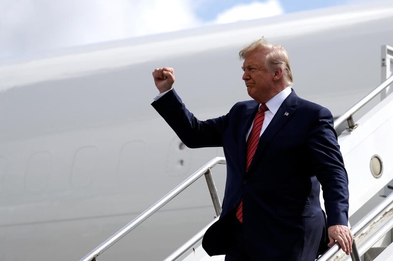 President Donald Trump arrives at Ellington Airport to attend "Howdy Modi: Shared Dreams, Bright Futures" event with Indian Prime Minister Narendra Modi, Sunday, Sept. 22, 2019, in Webster, Texas. (AP Photo/Evan Vucci)