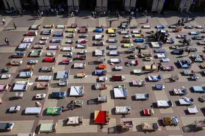 The Empty Beds Installation which contains 230 beds and bassinets representing the hostages is seen from above in Safra Square in Jerusalem. Getty Images