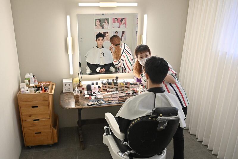 Blitzers member Hong Seung-hyun having his make-up done at a beauty salon in Seoul ahead of a promotional shoot. AFP
