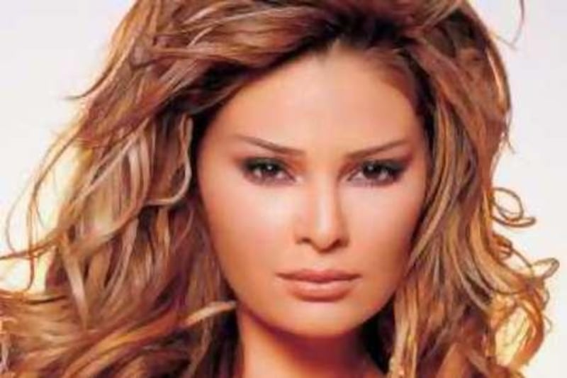 (FILES) An undated file picture shows Lebanese singer Suzanne Tamim posing during a photoshoot in Egypt. Egyptian tycoon Hisham Talaat Mustafa was arrested and charged on September 2, 2008 with ordering the brutal killing of Lebanese pop singer Suzanne Tamim in Dubai in July 2008, state media reported. AFP PHOTO/STR *** Local Caption ***  215089-01-08.jpg