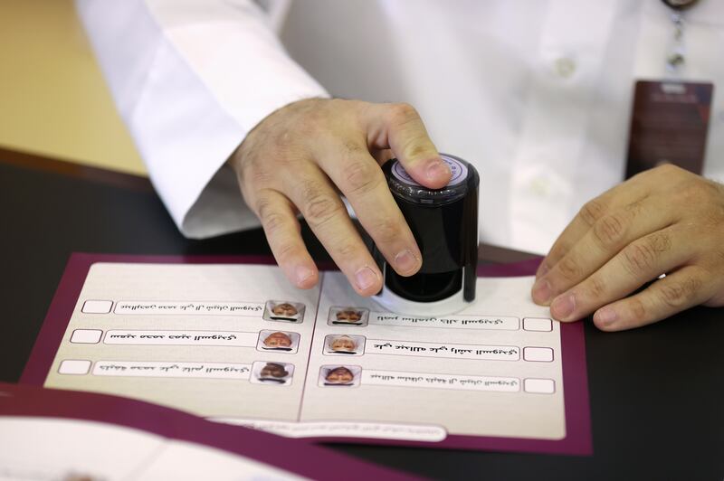An official stamps a ballot paper. Reuters