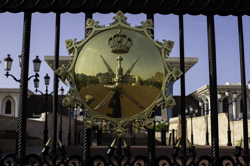 A Royal seal sits on the entrance gates to the Al Alam Palace, a royal residence of Sultan Qaboos of Oman, in Muscat, Oman, on Sunday, May 6, 2018. Being the Switzerland of the Gulf served the country well over the decades, helping the sultanate survive, thrive and make it a key conduit for trade and diplomacy in the turbulent Middle East. Photographer: Christopher Pike/Bloomberg