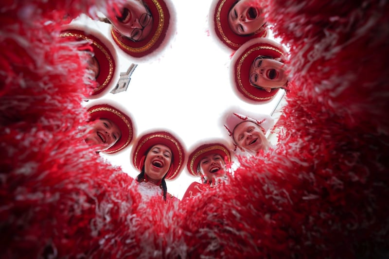 Members of the Marne Karnival Society celebrate on the way to the town hall in Marne, northern Germany. AP