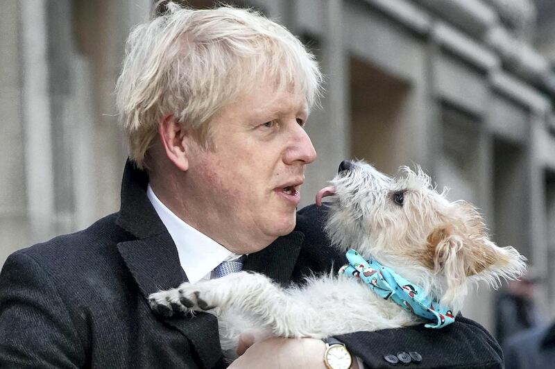 LONDON, UNITED KINGDOM - DECEMBER 12: Prime Minister Boris Johnson poses outside Methodist Hall polling station as he casts his vote with dog Dilyn, on December 12, 2019 in London, England. The current Conservative Prime Minister Boris Johnson called the first UK winter election for nearly a century in an attempt to gain a working majority to break the parliamentary deadlock over Brexit. The election results from across the country are being counted overnight and an overall result is expected in the early hours of Friday morning. (Photo by Christopher Furlong/Getty Images)
